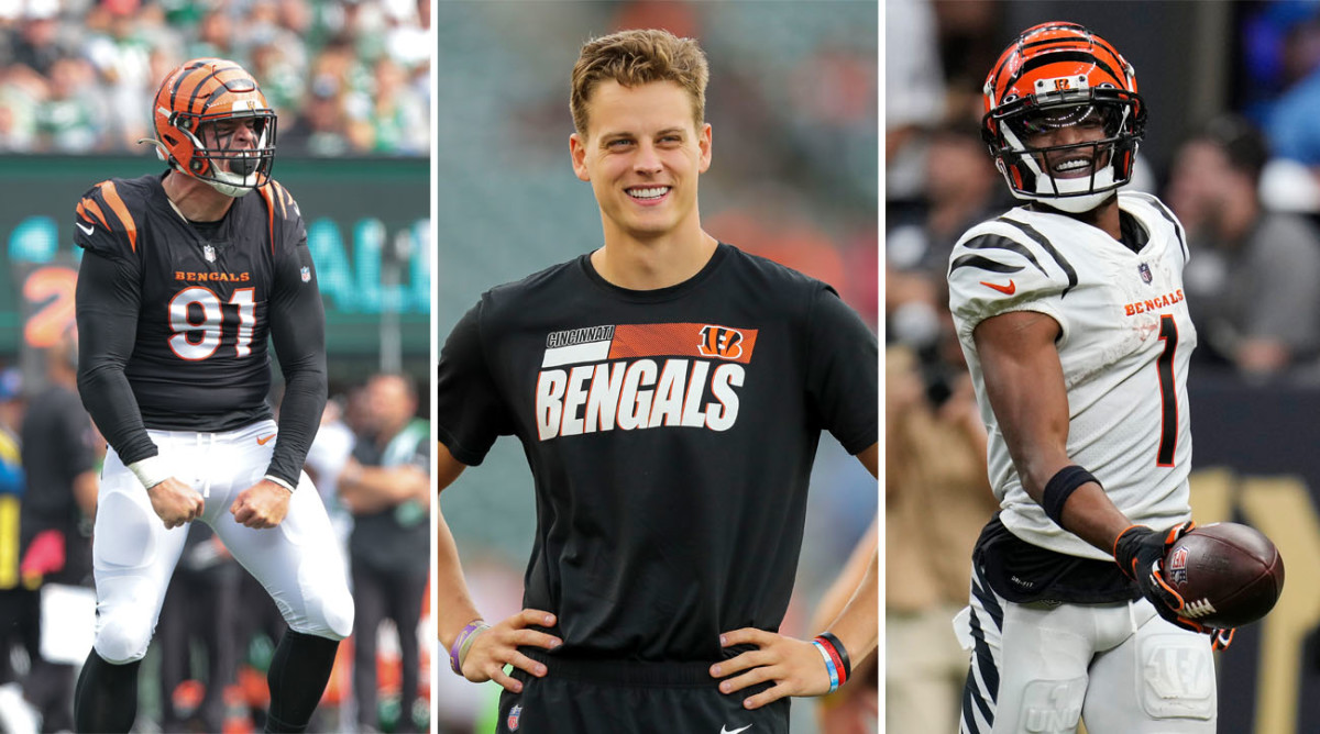 Trey Hendrickson yells as he flexes his arms toward the ground; Joe burrow stands smiling with his hands on his hips; Ja’Marr Chase smiles holding the ball out in one hand